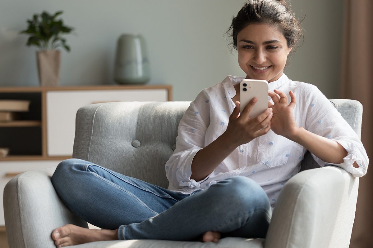 girl using wifi on phone, technology experts website design
